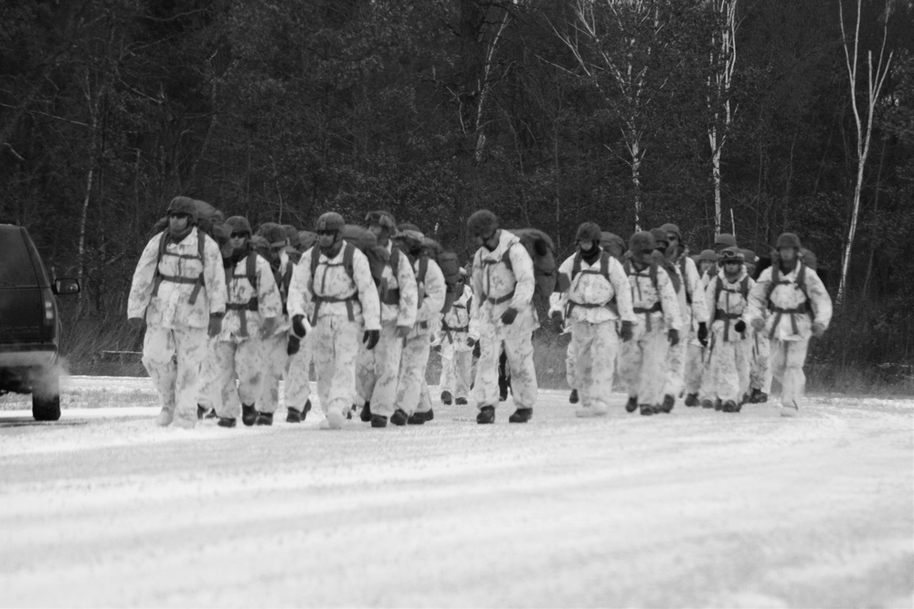 Cold-Weather Operations Course 18-01 students, all Marines, march to training at Fort McCoy