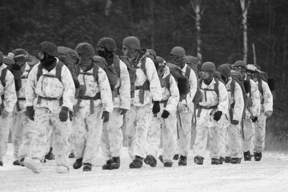 Cold-Weather Operations Course 18-01 students, all Marines, march to training at Fort McCoy