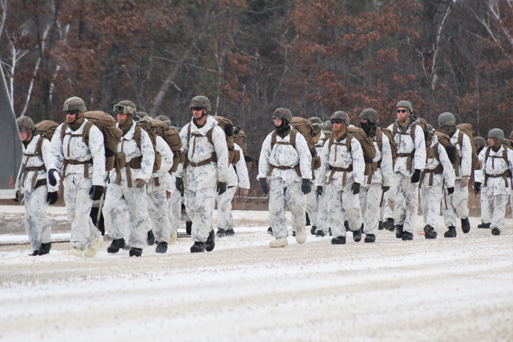 Cold-Weather Operations Course 18-01 students, all Marines, march to training at Fort McCoy