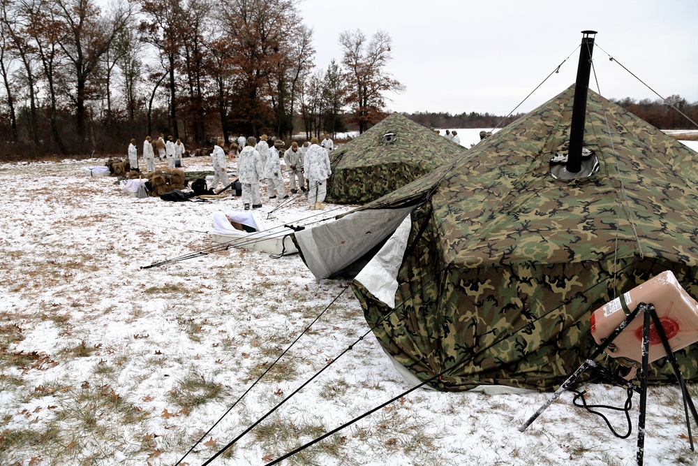 Cold-Weather Operations Course 18-01 students, all Marines, practice tentbuilding at Fort McCoy