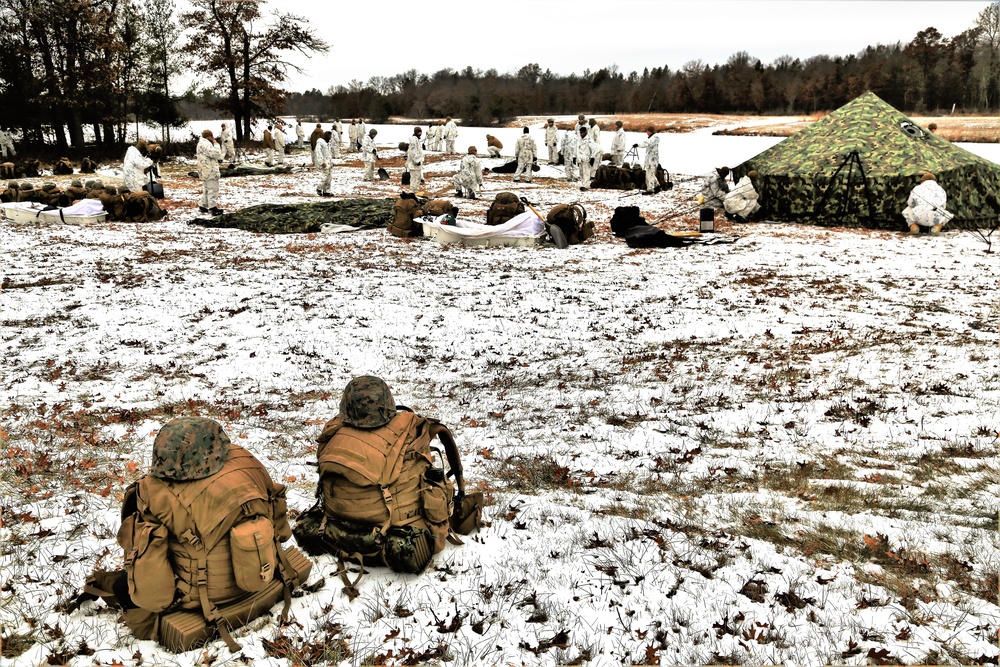 Cold-Weather Operations Course 18-01 students, all Marines, practice tentbuilding at Fort McCoy