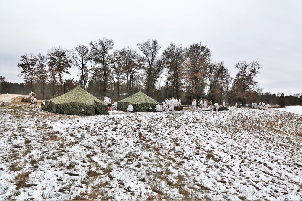 Cold-Weather Operations Course 18-01 students, all Marines, practice tentbuilding at Fort McCoy