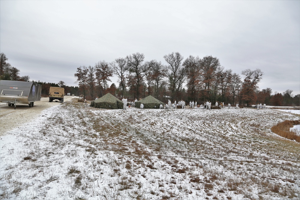 Cold-Weather Operations Course 18-01 students, all Marines, practice tentbuilding at Fort McCoy