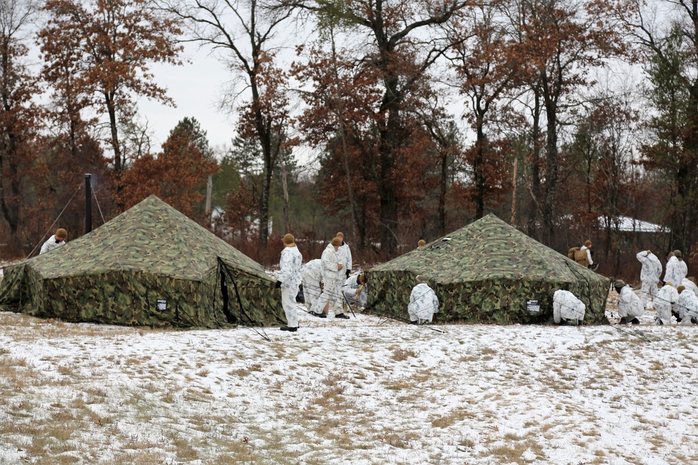 Cold-Weather Operations Course 18-01 students, all Marines, practice tentbuilding at Fort McCoy