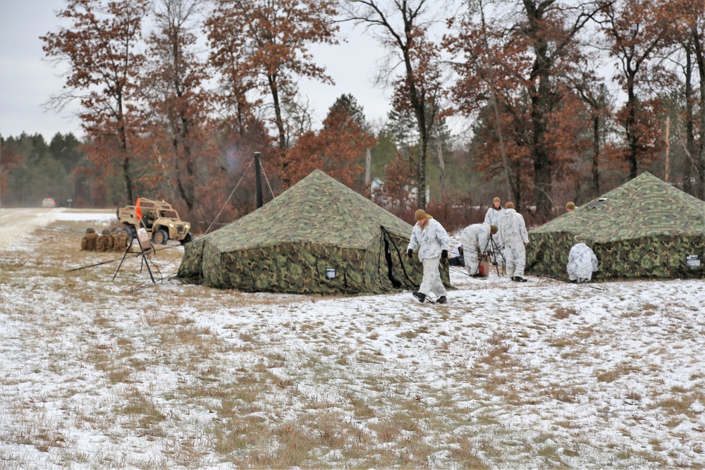 Cold-Weather Operations Course 18-01 students, all Marines, practice tentbuilding at Fort McCoy