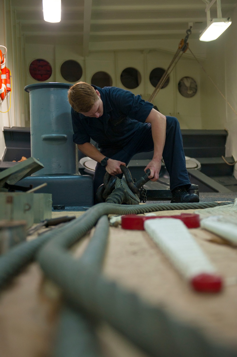 USS America Sailor lays out the towing lanyard in the forecastle