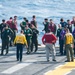 USS America (LHA 6) Sailors and Marines participate in FOD walkdown before flight quarters