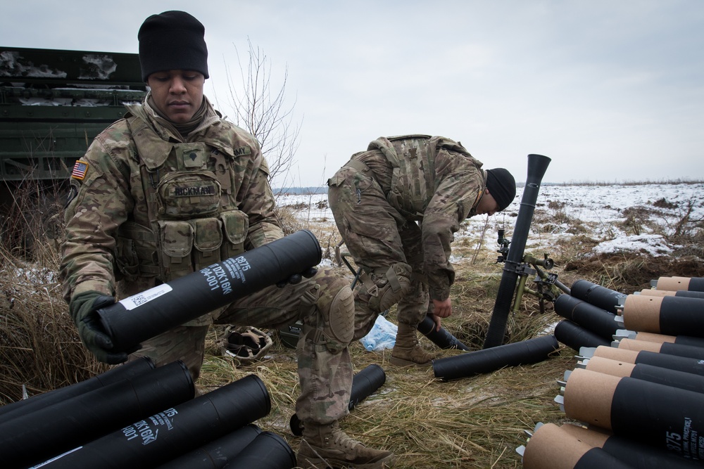 US Soldiers shoot mortars in coordinated fire exercise