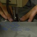Aircrew flight equipment Airman sews for a living