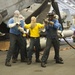 USS America Sailors participate in fire drill in the hangar bay