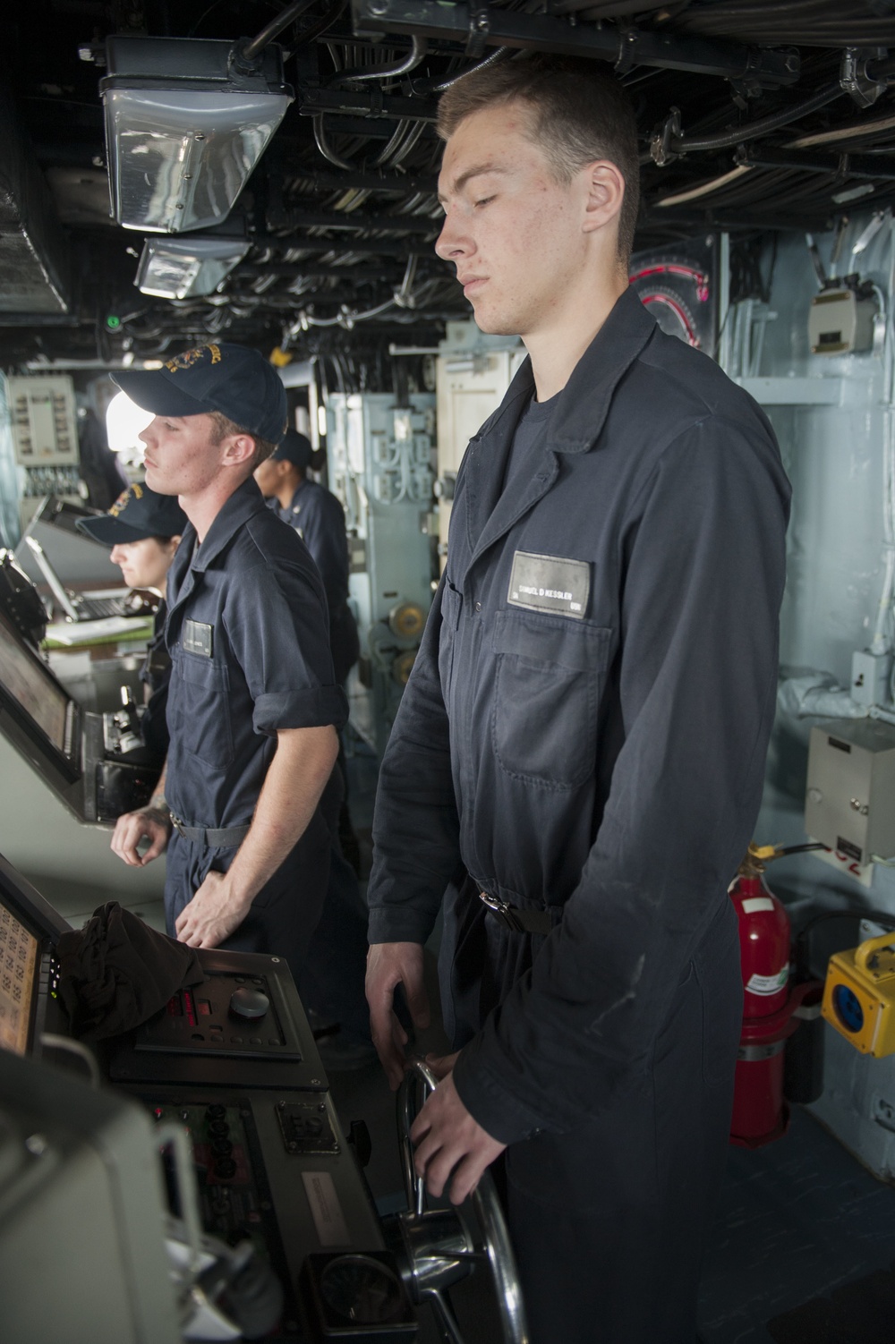 USS America (LHA 6) Sailor stands lee helm watch on the bridge