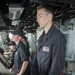 USS America (LHA 6) Sailor stands lee helm watch on the bridge