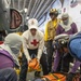 USS AMerica Sailor directs Sailors on casualty procedures