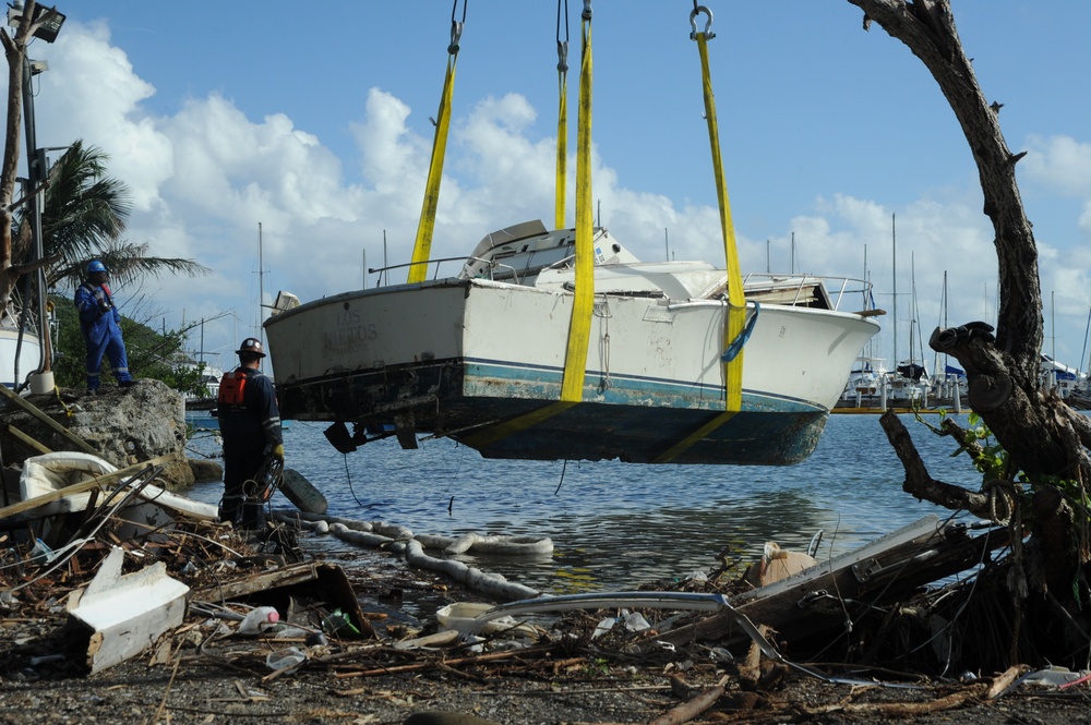 Hurricane response crews in Puerto Rico salvage vessel in Sardinera, Puerto Rico