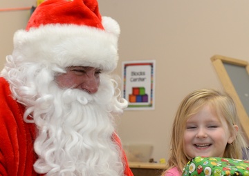 Santa flies with 28th OG giving gifts to families