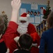 Santa flies with 28th OG giving gifts to families