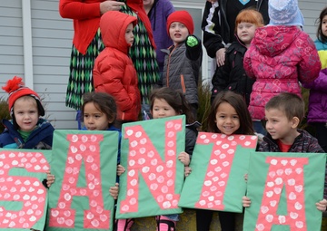 Santa flies with 28th OG giving gifts to families