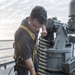 USS AMerca Sailors readies ammo for live fire exercise