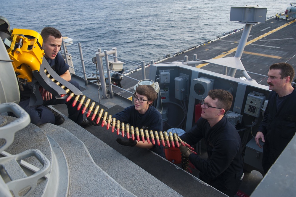 USS America (LHA 6) Sailors load CIWS