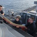 USS America (LHA 6) Sailors load CIWS