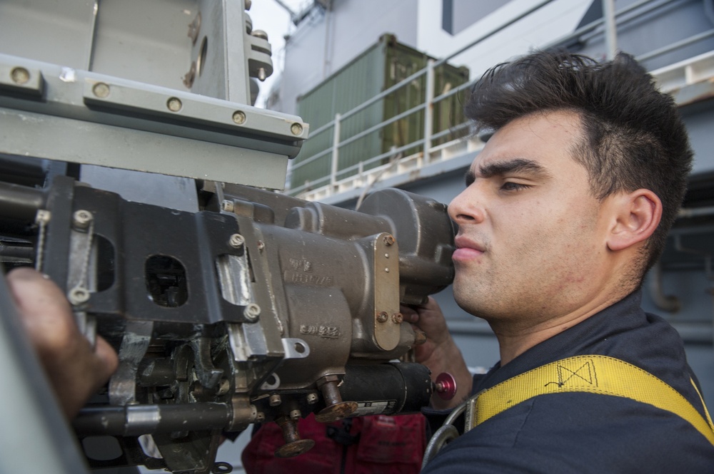 USS America Sailor removes weapons system reciever