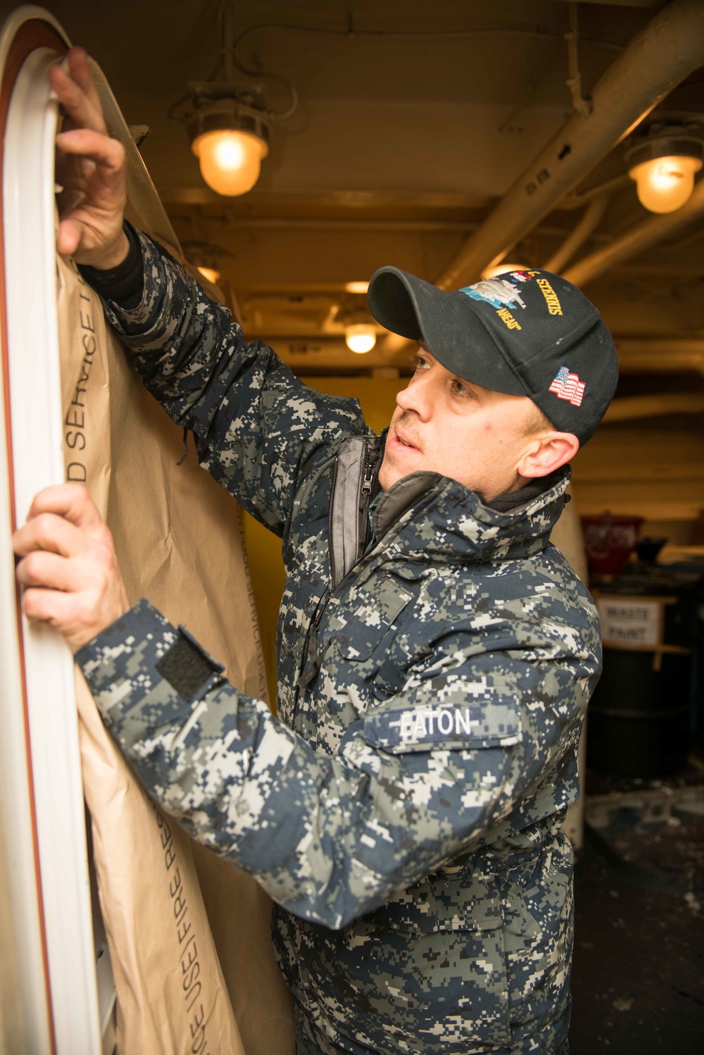 John C. Stennis Sailor Prepares a Hatch for Painting