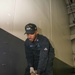 John C. Stennis Sailor Lays Down Hangar Bay Door Track