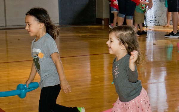 Families walk through AMR Winter Wonderland