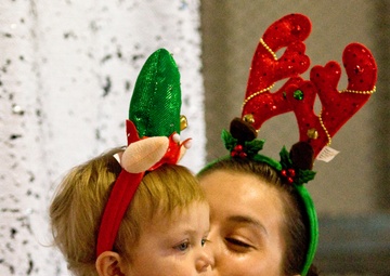 Families walk through AMR Winter Wonderland