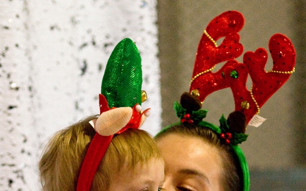 Families walk through AMR Winter Wonderland