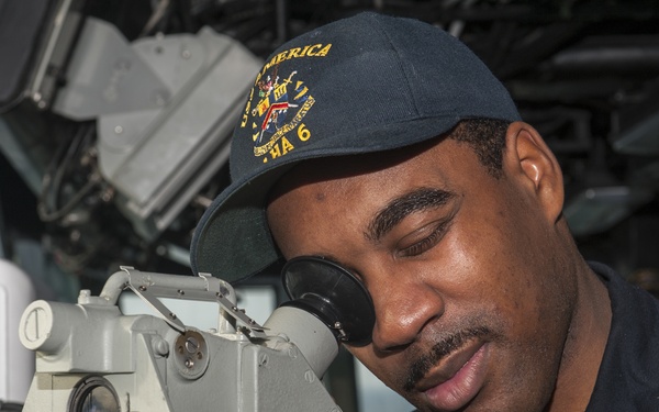 USS AMerica Sailor records ship's bearing