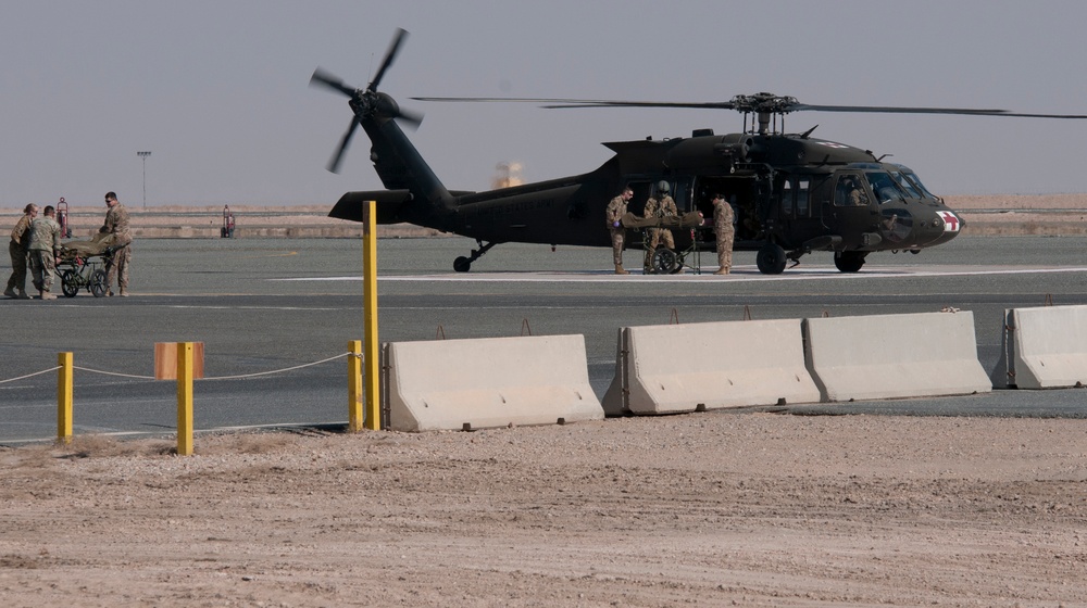 Medical personnel evacuate mock patient during training