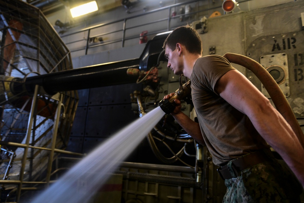 USS San Diego (LPD 22) Boatswain's Mate Washes Down LCAC