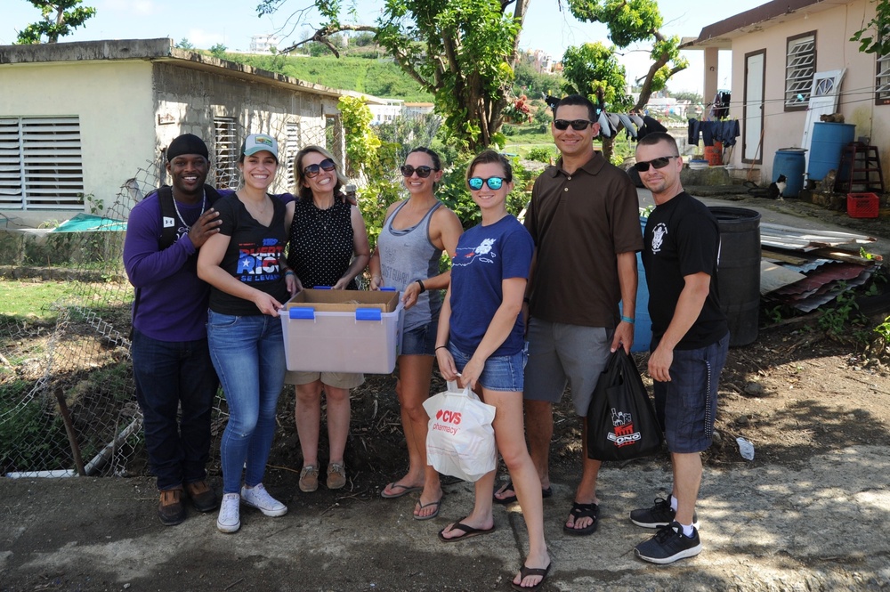 Coast Guardsmen deliver toys to children in Naguabo, Puerto Rico