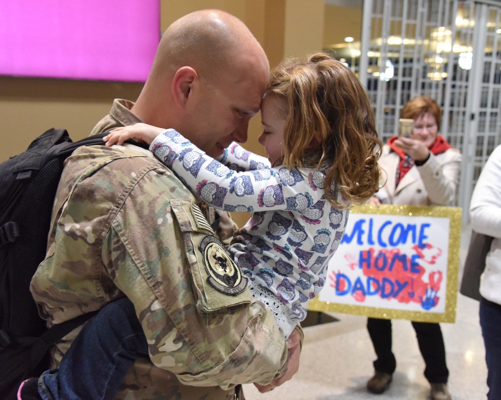 119th Wing members return to warm welcome from families