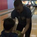 31st MEU Marines and local children “Bowl with the Times”