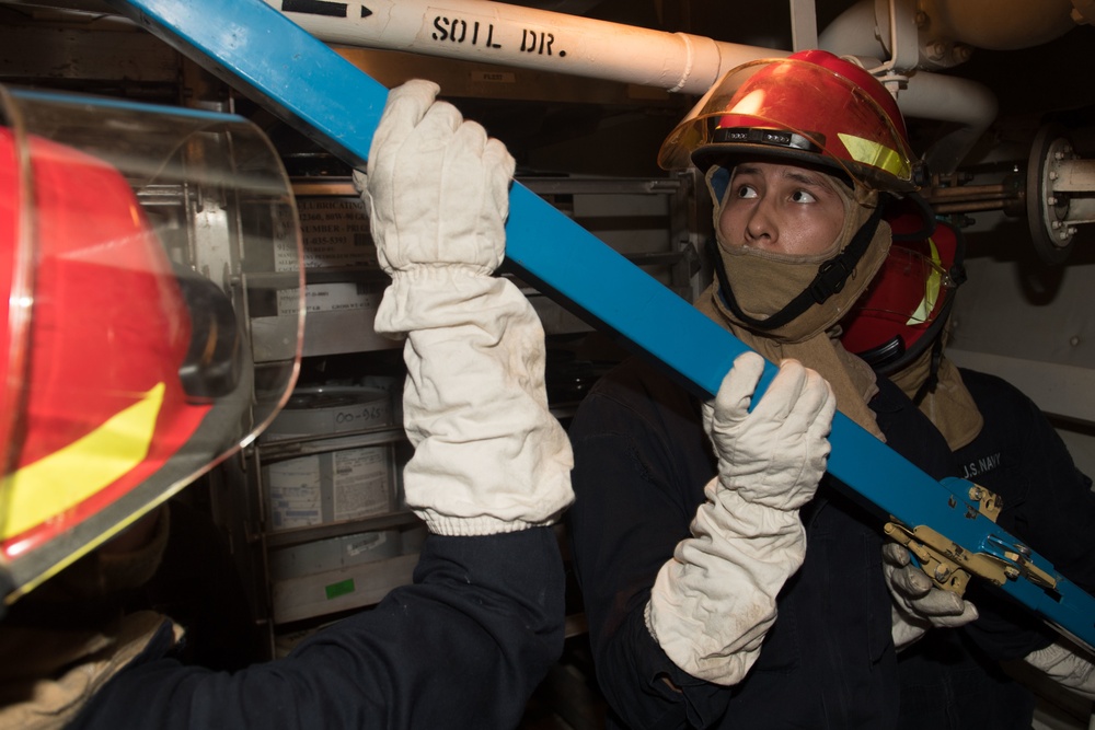 USS Pearl Harbor Sailors participate in a flying squad drill