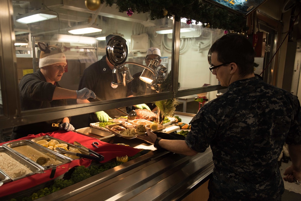 John C. Stennis Command Master Chief Serves Christmas Meal to Sailors