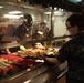 John C. Stennis Command Master Chief Serves Christmas Meal to Sailors