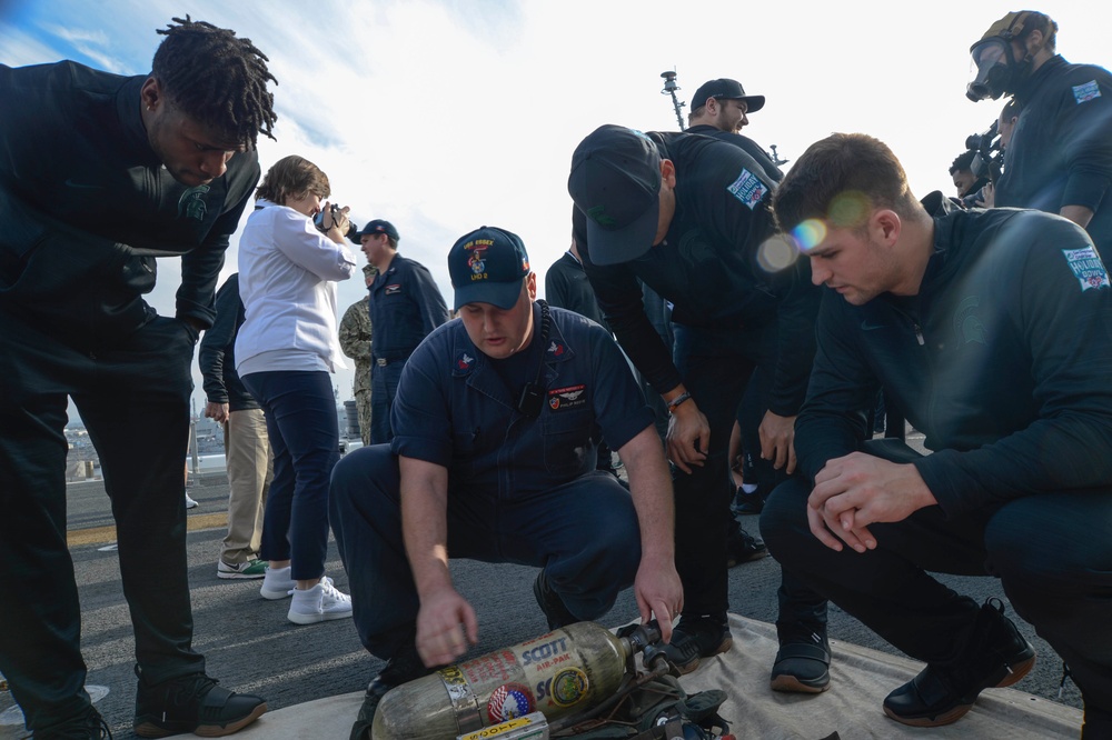 USS ESSEX HOSTS HOLIDAY BOWL AND TOUR