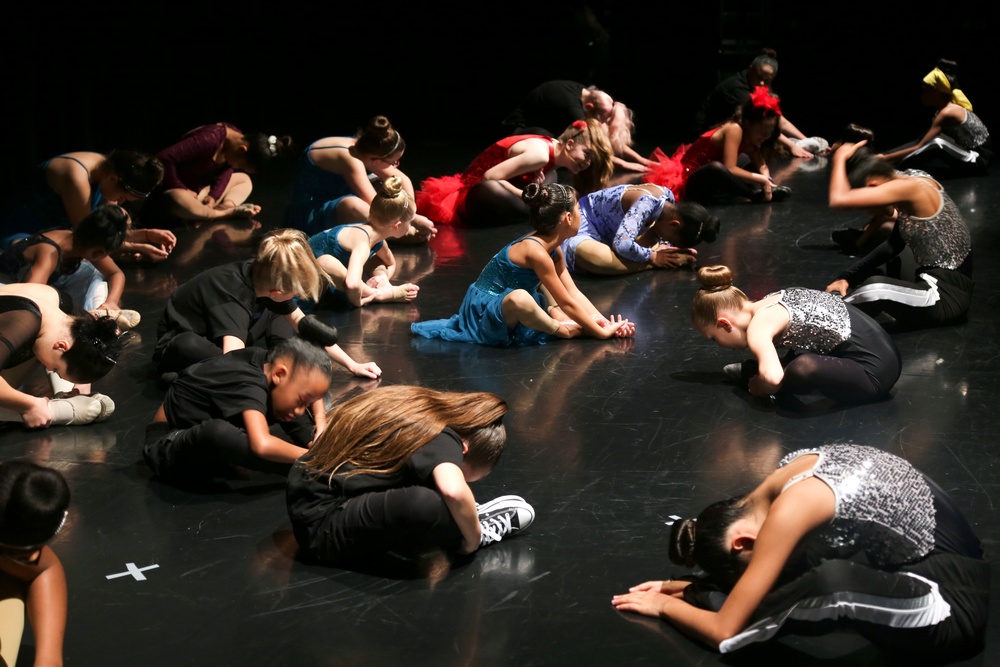 Marines volunteer with dancers at FootLoose Winter Showcase