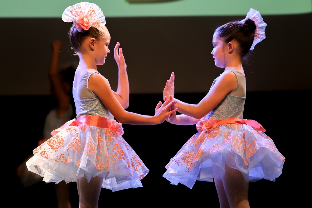 Marines volunteer with dancers at FootLoose Winter Showcase