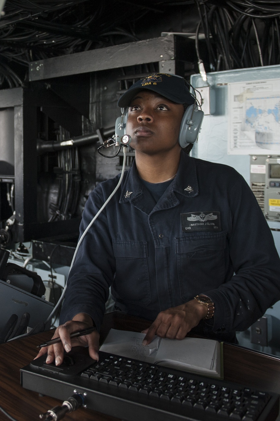 USS America Sailor stands detail plotter watch