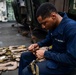 USS San Diego (LPD 22) Embarked Marine Cleans Life Preservers