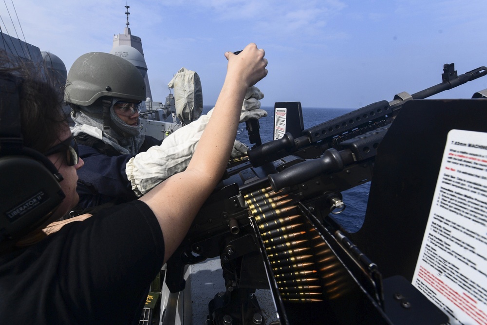 USS San Diego (LPD 22) Sailors Load Dual M-240 Machine Guns