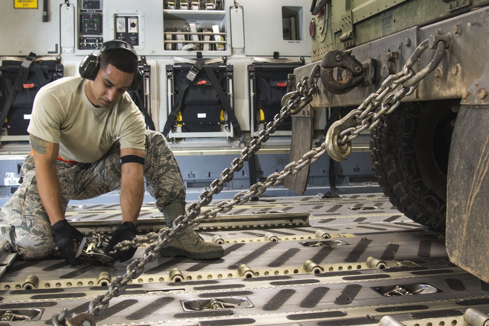 Port Dawgs secure equipment aboard C-17 aircraft