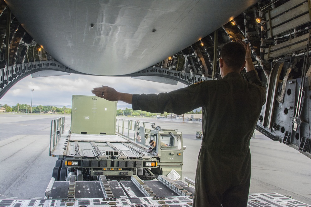 Port Dawgs secure equipment aboard C-17 aircraft