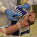 Airmen donate blood for Battle of the Badges campaign