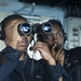 USS America Sailor stands detail plotter watch