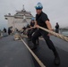 USS Pearl Harbor departs Singapore